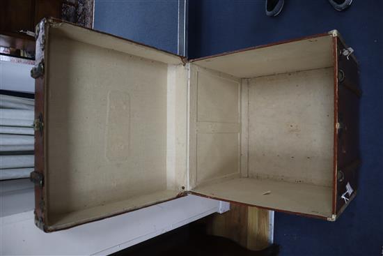 A Victorian leather covered wooden bound trunk W.60cm